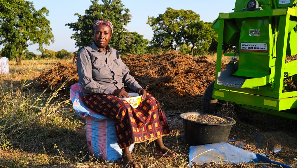 Madam Aishatu Seidu with the multi-crop thresher